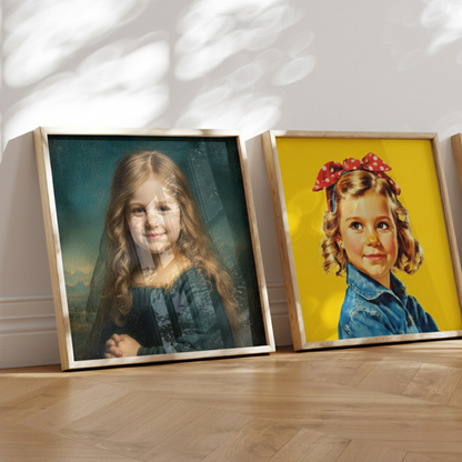 Two framed portraits of young girls on a wooden floor with a white wall background.